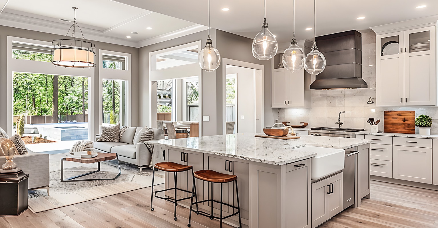 Une cuisine moderne et fonctionnelle ouverte sur un grand salon lumineux, créant un espace convivial et élégant, idéal pour ceux qui ont une passion maison. 