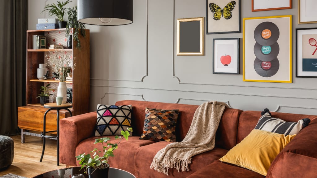 Living room with couch and gallery of quirky posters