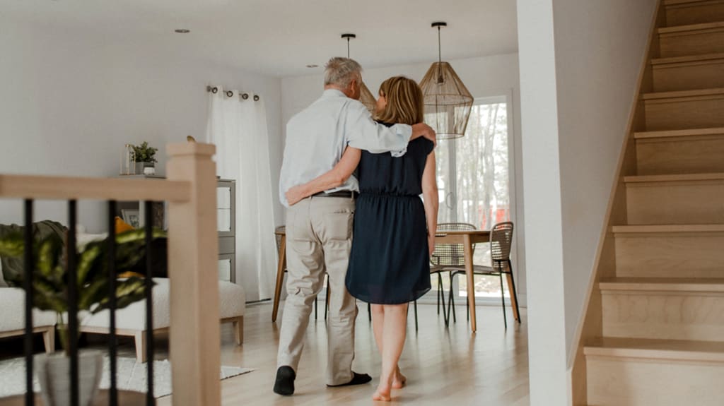 A couple is entering their home