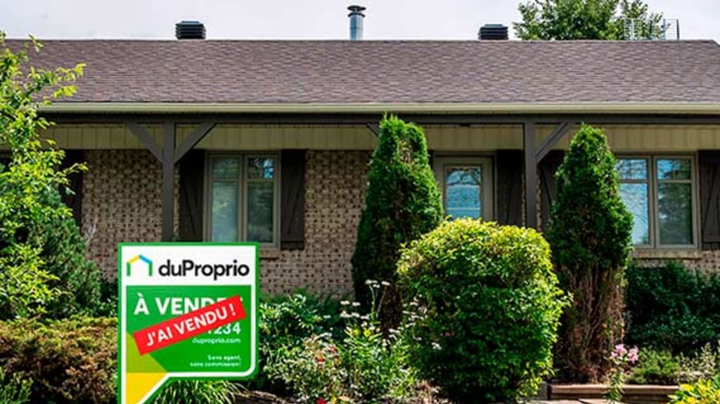 House sold with DuProprio sign in front
