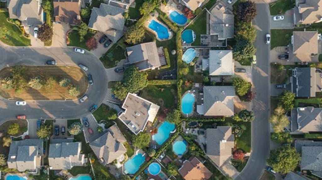 Aerial view of residential streets and homes in a beautiful neighborhood