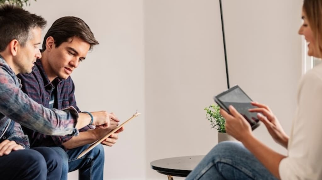 Potential buyer couple negotiating with seller when buying a house
