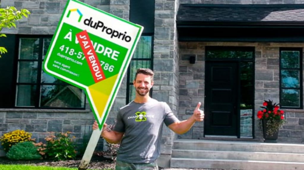 Man standing in front of his house with a sold DuProprio sign