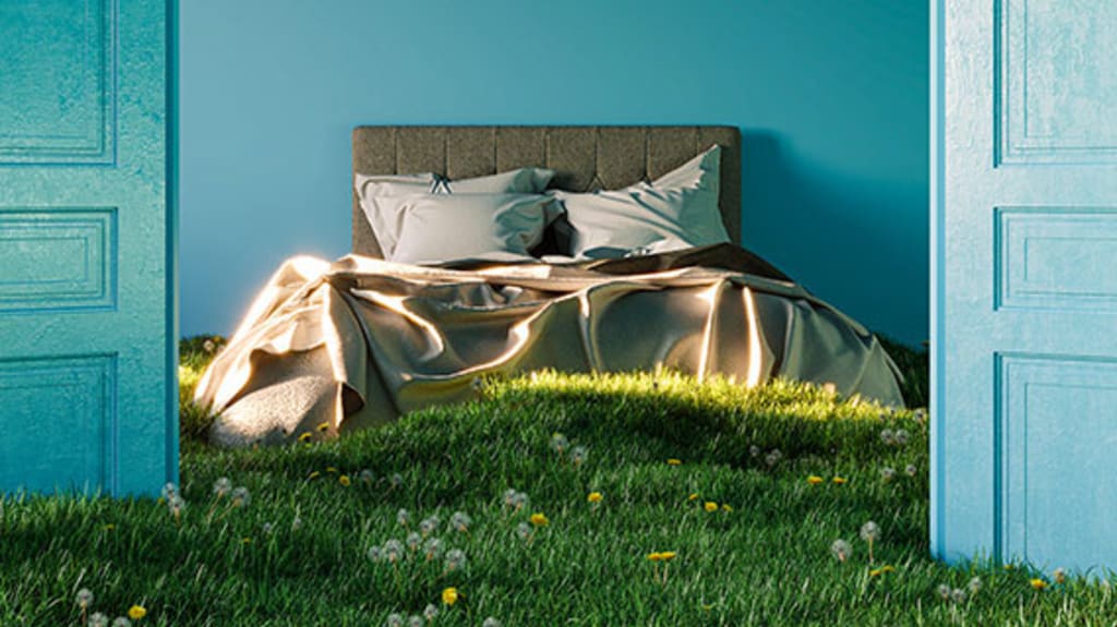 Bed in a bedroom with a grass floor