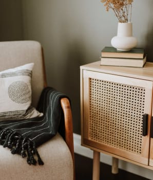 Armchair and occasional furniture in a corner of the house