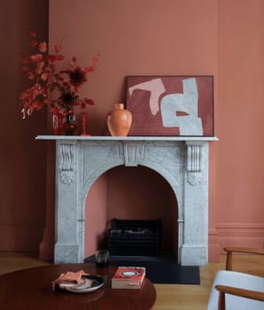 Rust-colored living room wall and accessories