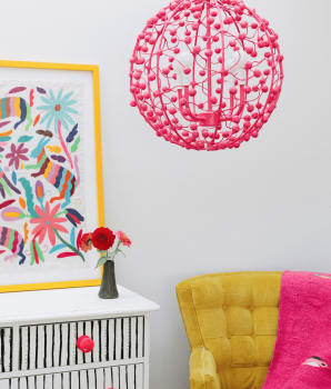 Pink lighting, yellow sofa and pink blanket