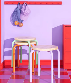 Retro tiles on floor, wall and accessories in shades of mauve and pink
