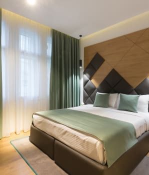 Green curtains in a bedroom