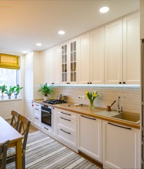 Yellow Roman shades in a kitchen