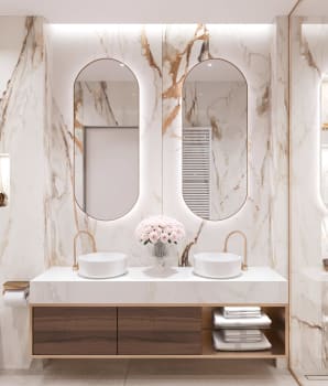 Salle de bain luxueuse avec motifs de veines sur la céramique et quincaillerie dorée 