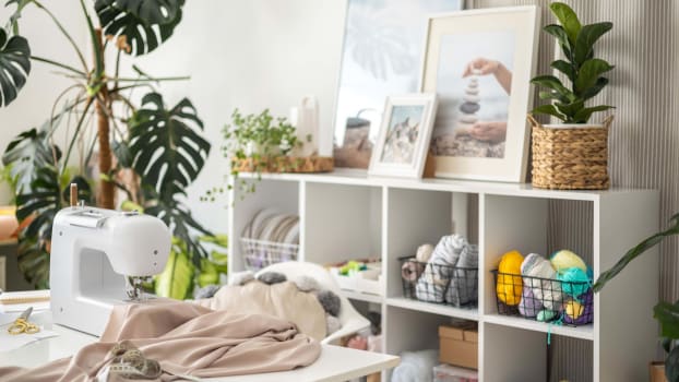 Creative space in a house with storage unit, sewing machine and DIY materials