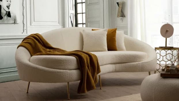 Beige curly sofa in a modern living room