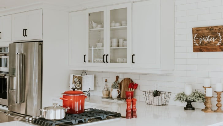 White kitchen with bright red cookware