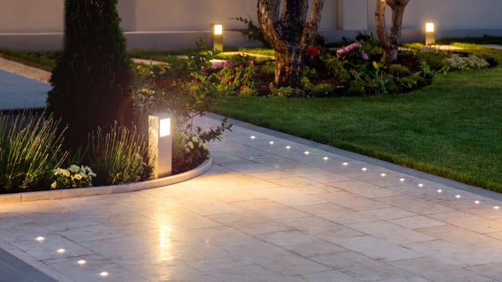 Garden path in the early evening with lights