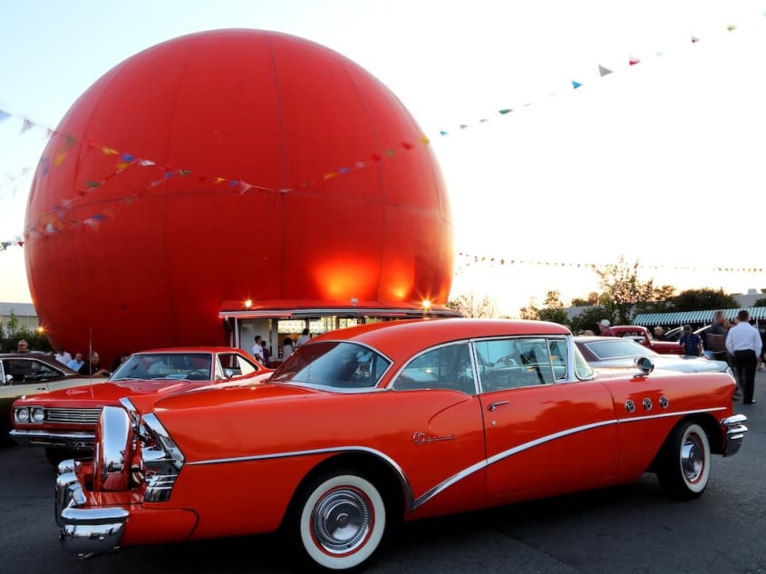 Vintage car and large orange sphere from Gibeau Orange Julep