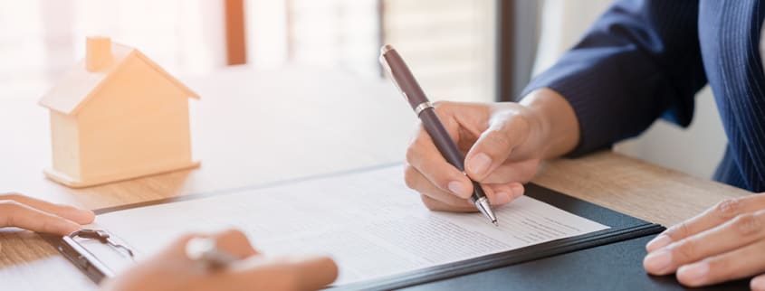 Person signing on a new mortgage