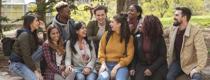 A group of study abroad students in a front of a Canadian university