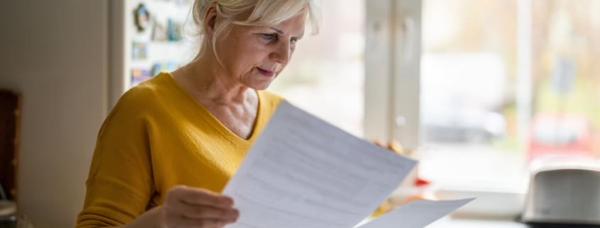 A woman looking at a seller's declaration