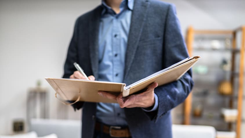 Appraiser holding a notebook