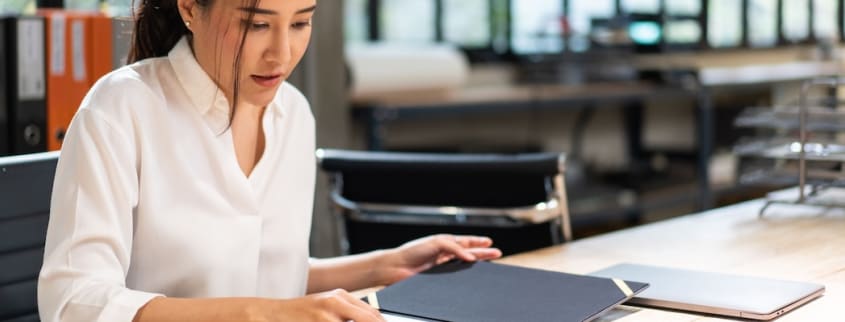 A notary reviews an offer to purchase for her clients