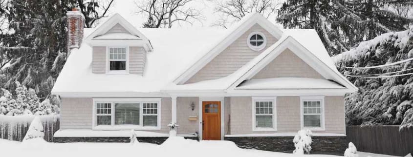 Beige house in the snow